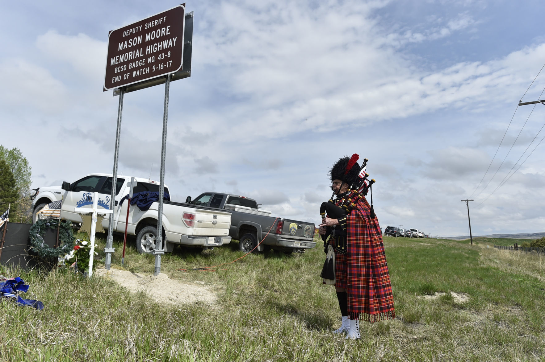 People gather on Highway 287